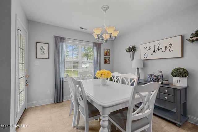 202 Two Oaks Ct, Newport, NC 28570 - dining space featuring a chandelier, visible vents, and baseboards