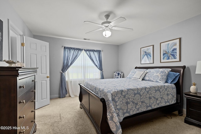 202 Two Oaks Ct, Newport, NC 28570 - bedroom with baseboards, visible vents, a ceiling fan, and light carpet