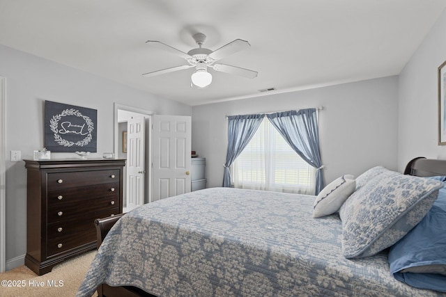 202 Two Oaks Ct, Newport, NC 28570 - bedroom with visible vents, a ceiling fan, baseboards, and light carpet