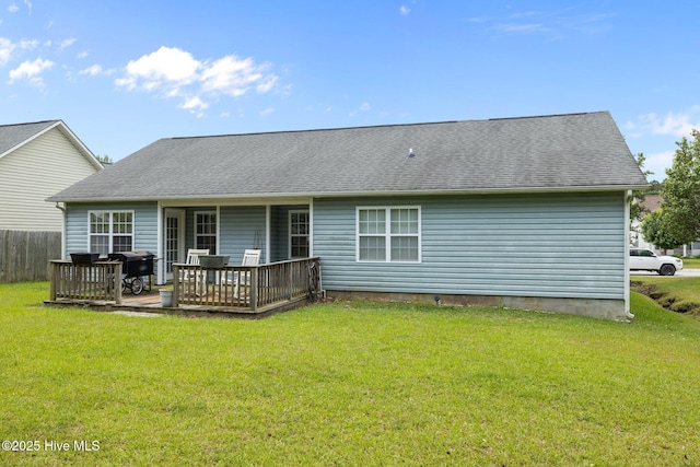 202 Two Oaks Ct, Newport, NC 28570 - rear view of property with a wooden deck, a lawn, a shingled roof, and fence