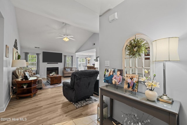 202 Two Oaks Ct, Newport, NC 28570 - living room featuring high vaulted ceiling, a ceiling fan, wood finished floors, a fireplace, and visible vents