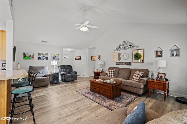 202 Two Oaks Ct, Newport, NC 28570 - living room featuring visible vents, light wood-style flooring, baseboards, high vaulted ceiling, and a ceiling fan