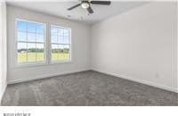 empty room featuring ceiling fan, baseboards, a healthy amount of sunlight, and carpet flooring
