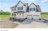 view of front of home featuring an attached garage and driveway