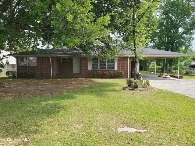2703 Langston Dr, Goldsboro, NC 27534 - ranch-style home featuring concrete driveway, a carport, a front lawn, and brick siding