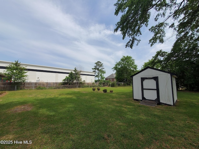 2703 Langston Dr, Goldsboro, NC 27534 - view of yard featuring a storage shed, fence, and an outbuilding