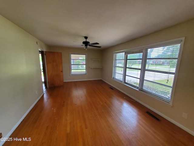 2703 Langston Dr, Goldsboro, NC 27534 - unfurnished room featuring baseboards, visible vents, a ceiling fan, and wood finished floors