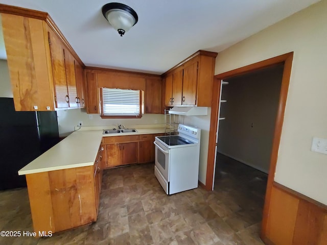 2703 Langston Dr, Goldsboro, NC 27534 - kitchen with brown cabinets, white electric stove, freestanding refrigerator, under cabinet range hood, and light countertops