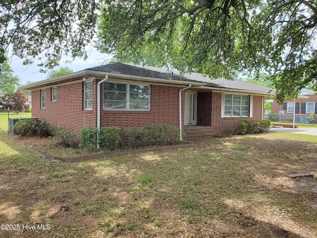 2703 Langston Dr, Goldsboro, NC 27534 - single story home with a front lawn, brick siding, and fence