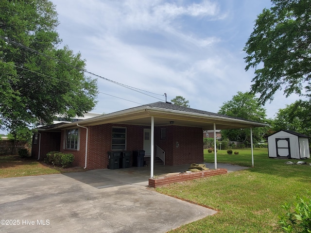 2703 Langston Dr, Goldsboro, NC 27534 - view of front facade with a storage shed, a front lawn, brick siding, and an outdoor structure