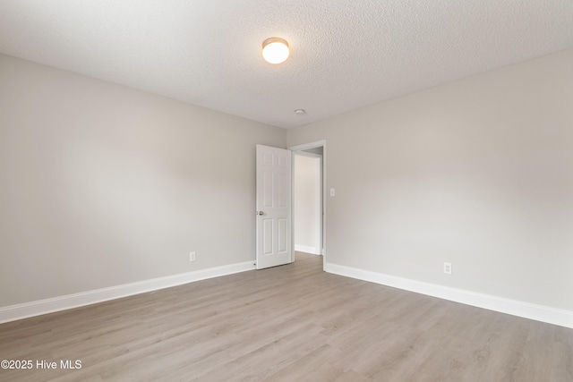 315 Whirlaway Blvd, Sneads Ferry, NC 28460 - unfurnished room featuring wood finished floors, baseboards, and a textured ceiling