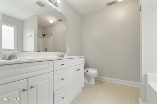 315 Whirlaway Blvd, Sneads Ferry, NC 28460 - full bathroom featuring double vanity, toilet, a shower, a textured ceiling, and baseboards