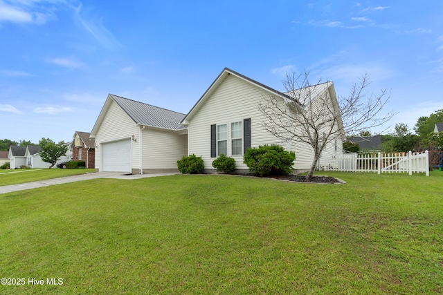 315 Whirlaway Blvd, Sneads Ferry, NC 28460 - view of front of home featuring a garage, concrete driveway, and metal roof