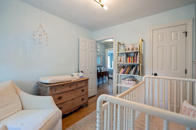 bedroom featuring light wood-style flooring