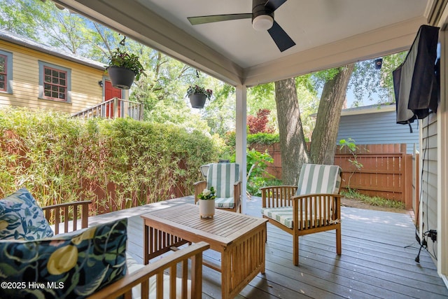 deck with fence and ceiling fan