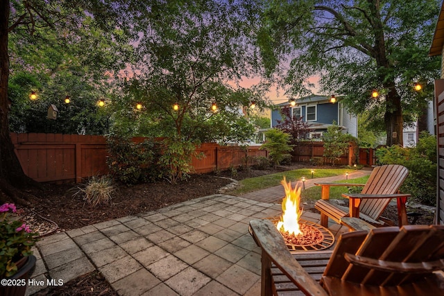view of patio / terrace featuring a fenced backyard and an outdoor fire pit