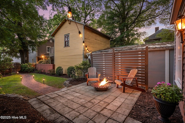 view of patio / terrace featuring a fenced backyard and a fire pit