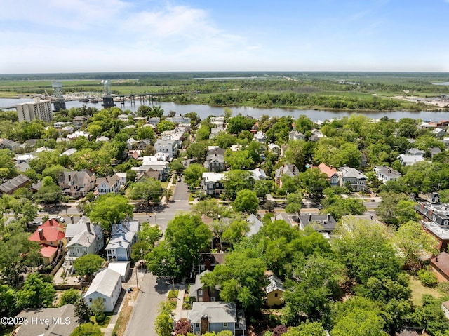 birds eye view of property with a residential view and a water view