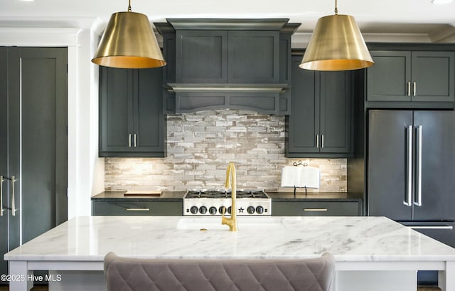 kitchen with decorative light fixtures, decorative backsplash, light stone counters, and stainless steel appliances