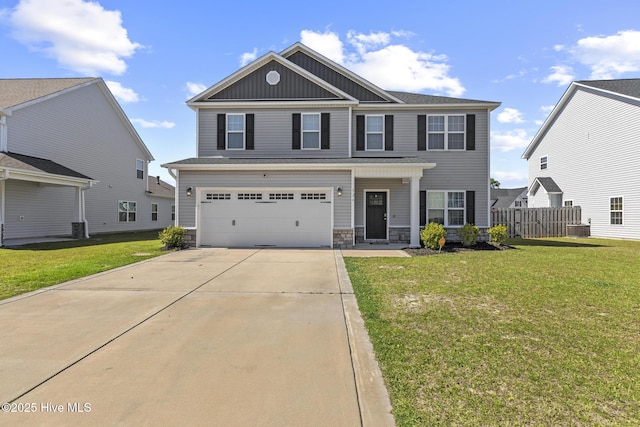 view of front facade featuring fence, an attached garage, stone siding, board and batten siding, and driveway