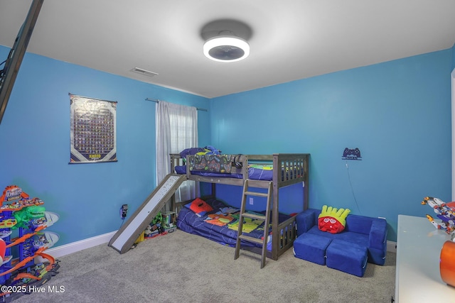 bedroom with baseboards, carpet flooring, and visible vents