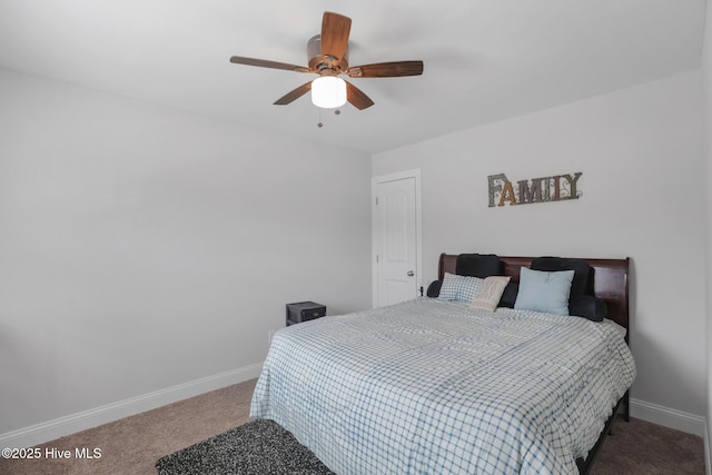 bedroom featuring baseboards, ceiling fan, and carpet