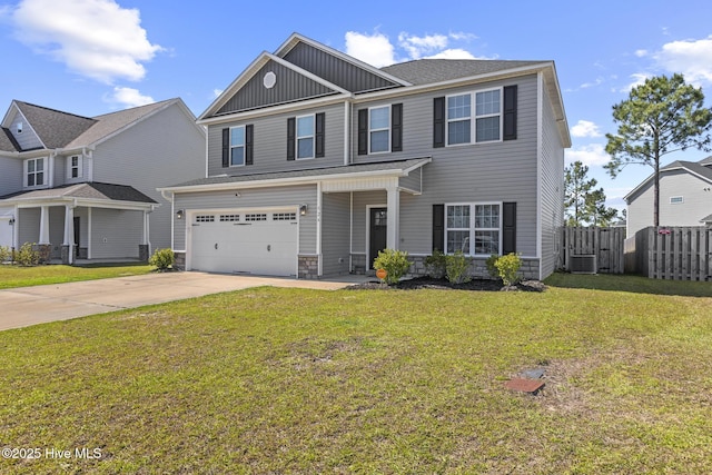 traditional home featuring fence, an attached garage, a front lawn, board and batten siding, and concrete driveway
