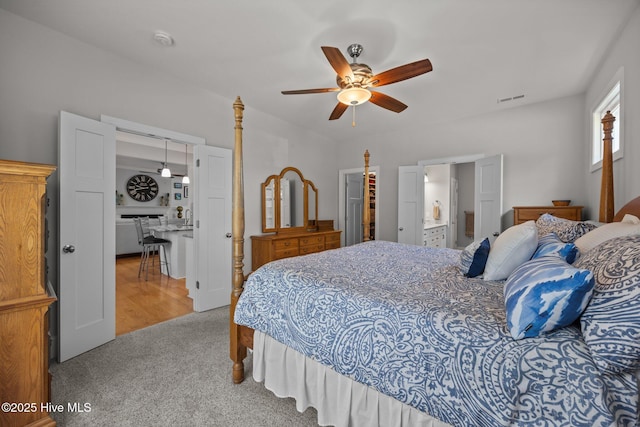 2312 Caracara Dr, New Bern, NC 28560 - carpeted bedroom with a ceiling fan and ensuite bathroom