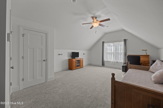 2312 Caracara Dr, New Bern, NC 28560 - bedroom with light colored carpet, vaulted ceiling, baseboards, and a ceiling fan