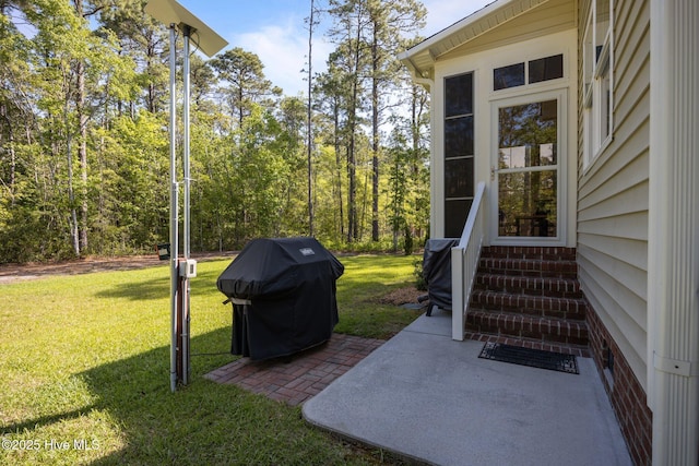 2312 Caracara Dr, New Bern, NC 28560 - view of grassy yard with entry steps and a patio area