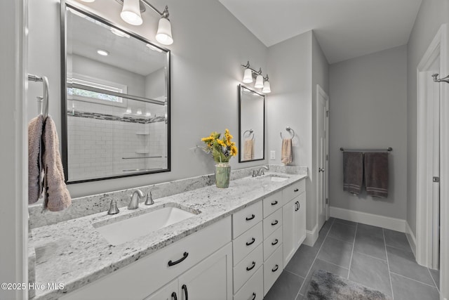 2312 Caracara Dr, New Bern, NC 28560 - bathroom with double vanity, a shower stall, tile patterned flooring, and baseboards