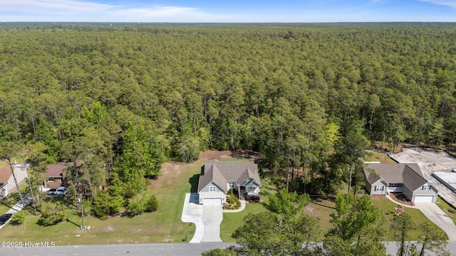 drone / aerial view with a view of trees