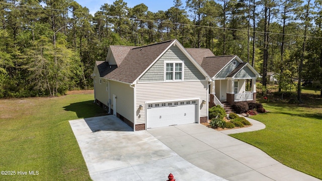 craftsman inspired home featuring covered porch, an attached garage, a front yard, and driveway
