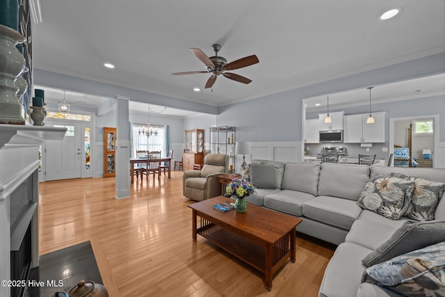 2312 Caracara Dr, New Bern, NC 28560 - living area with a ceiling fan, crown molding, a chandelier, light wood finished floors, and recessed lighting