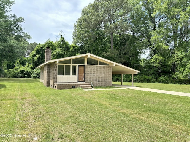 115 Cherry St, Woodland, NC 27897 - view of front of property featuring a chimney, concrete driveway, crawl space, and a front lawn