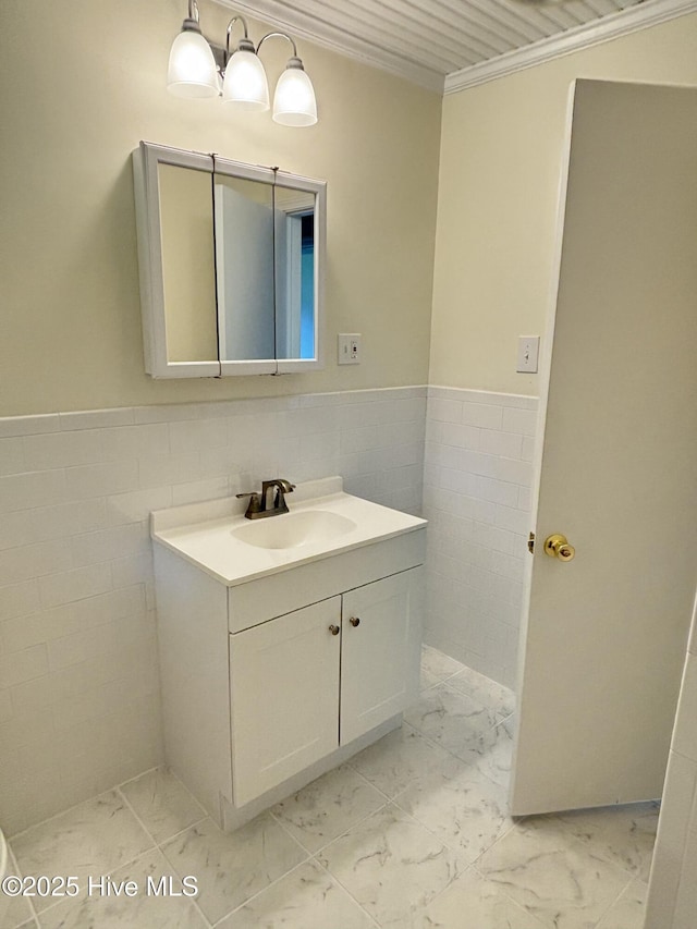 115 Cherry St, Woodland, NC 27897 - bathroom featuring vanity, a wainscoted wall, marble finish floor, and tile walls
