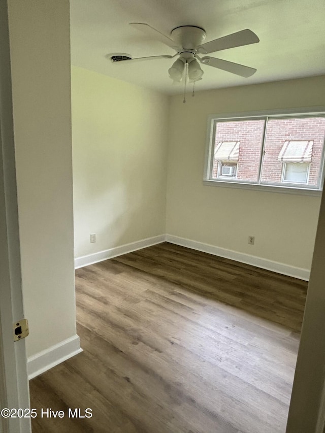 115 Cherry St, Woodland, NC 27897 - empty room featuring dark wood finished floors, baseboards, and a ceiling fan