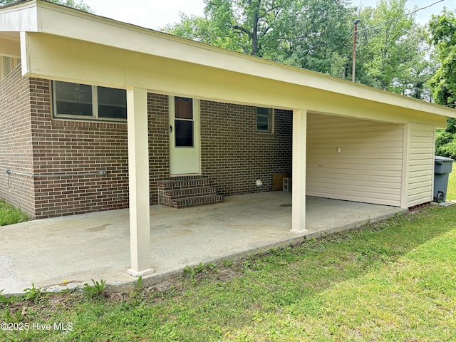 115 Cherry St, Woodland, NC 27897 - rear view of property with a patio, entry steps, and brick siding