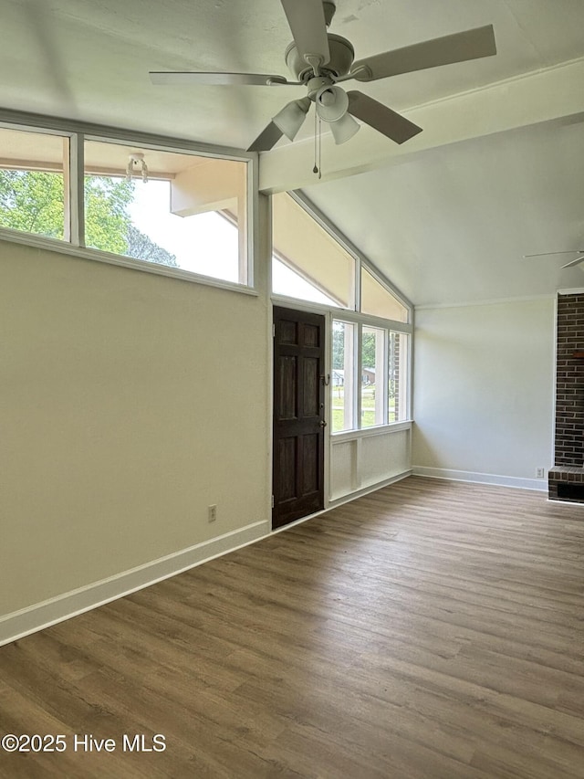 115 Cherry St, Woodland, NC 27897 - interior space with wood finished floors, lofted ceiling with beams, a ceiling fan, and baseboards
