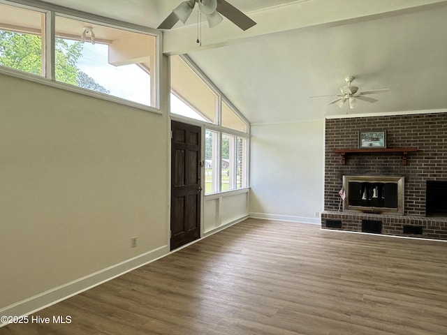 115 Cherry St, Woodland, NC 27897 - unfurnished living room featuring baseboards, a ceiling fan, and vaulted ceiling