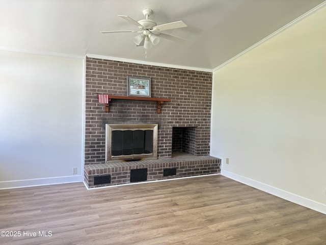 115 Cherry St, Woodland, NC 27897 - unfurnished living room featuring a fireplace, wood finished floors, ceiling fan, and ornamental molding