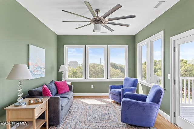 sunroom featuring visible vents and plenty of natural light