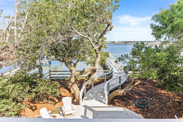 surrounding community featuring a water view