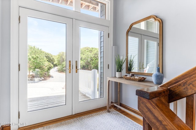 entryway with a healthy amount of sunlight, french doors, and wood finished floors