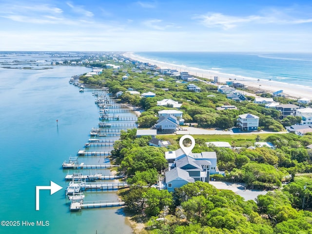 aerial view with a water view and a view of the beach