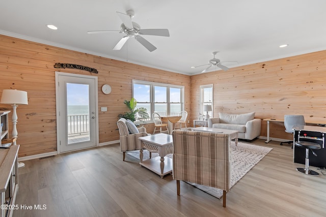 6621 W Beach Dr, Oak Island, NC 28465 - living room with ceiling fan, light wood-style flooring, wooden walls, ornamental molding, and recessed lighting