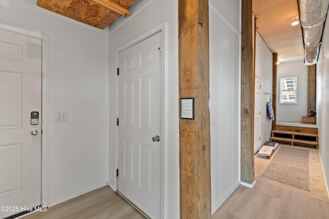 6621 W Beach Dr, Oak Island, NC 28465 - hall with light wood-style floors