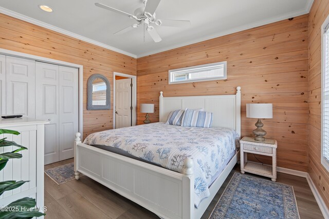 6621 W Beach Dr, Oak Island, NC 28465 - bedroom featuring wooden walls, ornamental molding, wood finished floors, ceiling fan, and recessed lighting