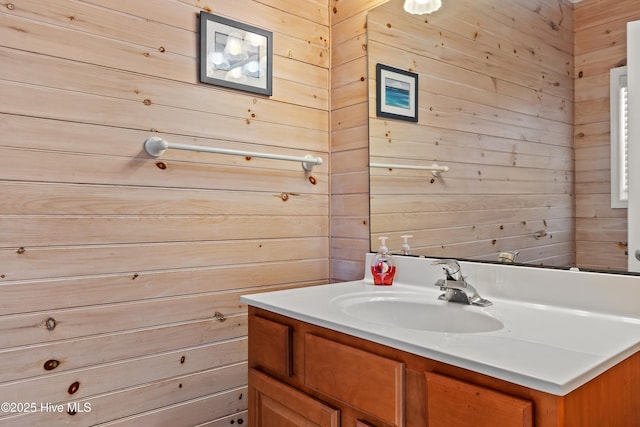 6621 W Beach Dr, Oak Island, NC 28465 - bathroom with wood walls and vanity
