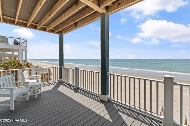 6621 W Beach Dr, Oak Island, NC 28465 - wooden deck with view of water and beach